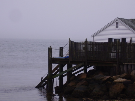 RI morning mist and the fishing rental cabin by the bay