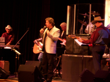 Johnny Owens singing at a theater in Nashville