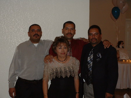 ME MY TWO BROTHERS AND MOM AT A PARTY
