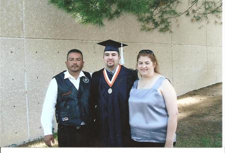 me and husband frank with our sons graduation