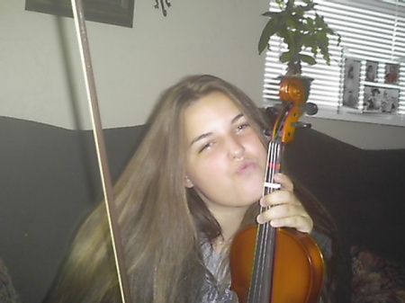my daughter carlee and her favorite thing the violin