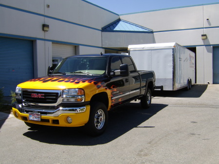 Still plays with hot wheels, My truck & trailer at my company.