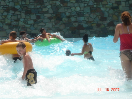 My baby trying to stand up in the wave pool