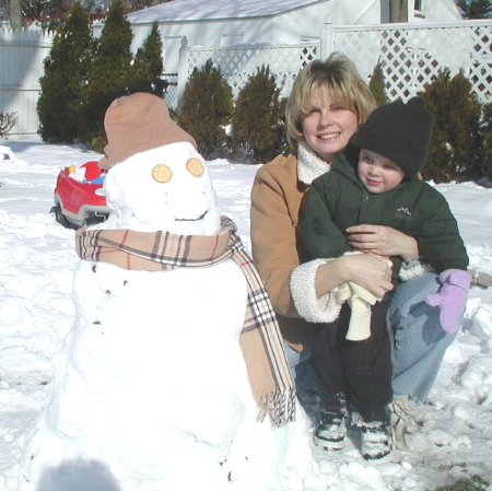 Liz with Frankie and their 1st snow man...now