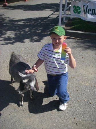 Brady with his goat and ribbon