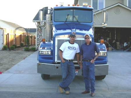 My husband Greg and his son Jon with his new truck.