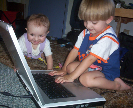 Jarom and Kaydance on the computer