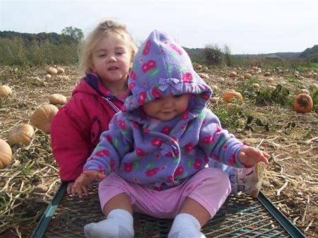 my grandaugther at the pumkin patch