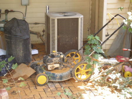 Flooded A/C unit and lawnmower