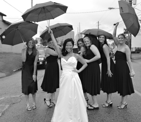 Sara and her wedding party in the rain