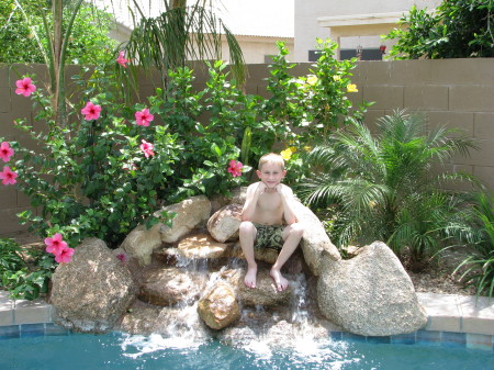 Logan hanging by the pool