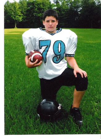 My 13 year old son, Alex.  He's played 9 yrs- Center/DE