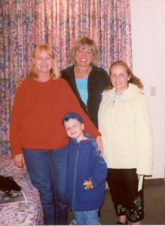 Marilyn Kramer (Bourg) and Gail Kramer (Davenport) with Wilda (Cookie) Blackwood and her grandson, Logan
