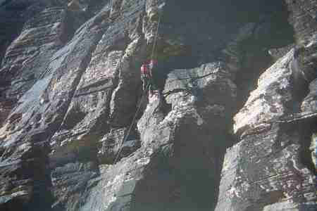 My wife rappelling a rock climb