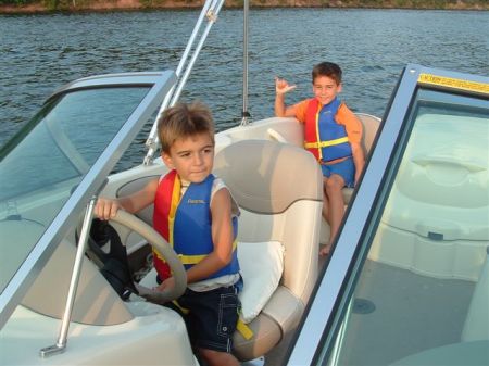 Michael driving boat. Chris hangin' loose at Raystown Lake