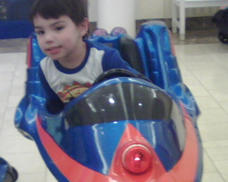 my gordito in his speedracer at the mall