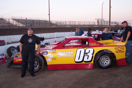 My husband Tom and our 4th child his racecar