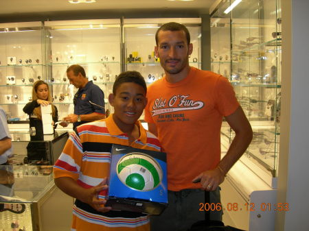 MY SON & ONE OF THE PLAYERS FROM THE SOCCER WORLD CUP CHAMPS AT NIKE TOWN IN N.Y.