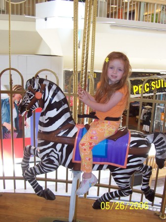 Alina on a zebra.