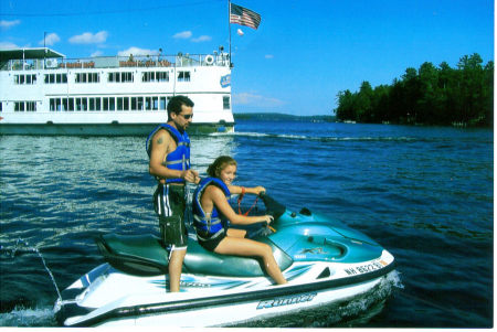 dad and daughter  having some water fun ( Lake Winnipesaukee)