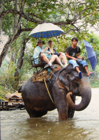 Bob & Joan on elephant in rain