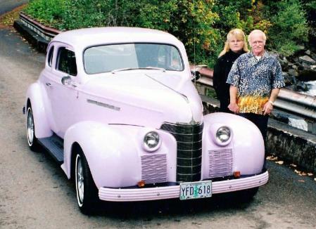 My husband and I and our '39 Olds (yes, its lavender)