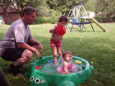 Hannah and Lindsay playing in the water with Grandpa-Summer 2004