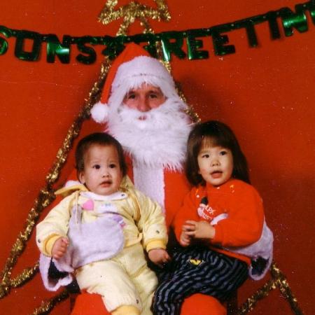My 2 daughters in a PX in Korea with Santa in 1989