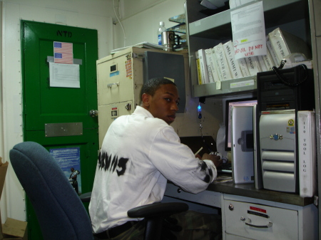 Workin hard on da computer in my boat uniform