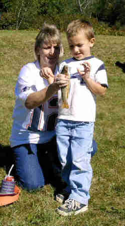 grammie and isaac 's trohpy fish good catch buddy:)