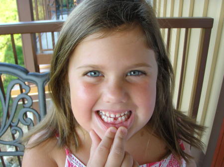 Mary Beth lost her first tooth!!