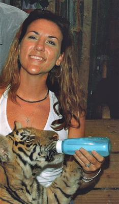 Yes, I am feeding a baby tiger...