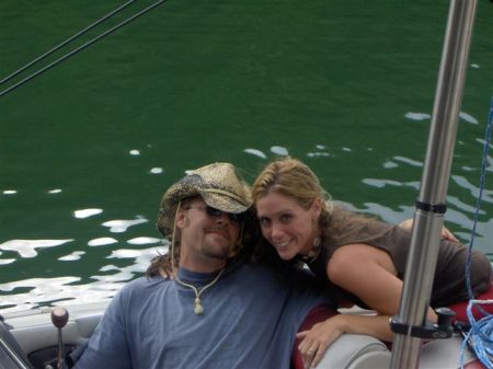 Me and my husband on our boat.