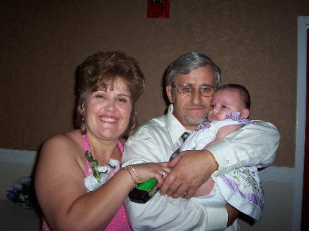  My husband, myself and Angelina at our sons wedding.