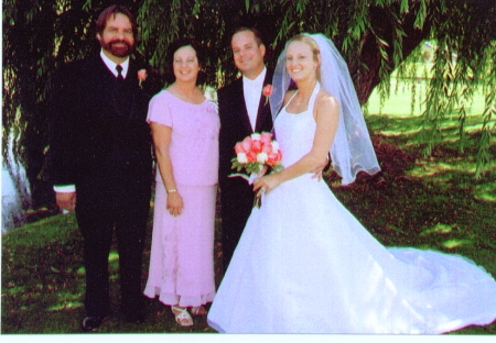 My wife and I with the newlyweds