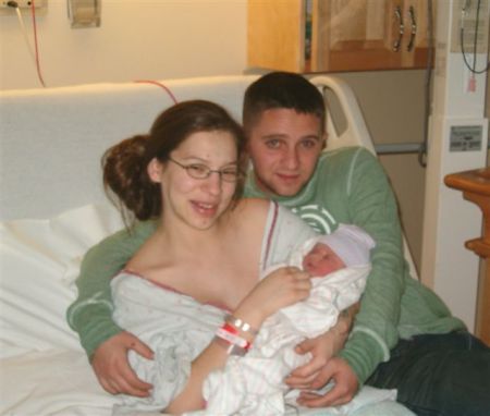 mommy and daddy with new baby