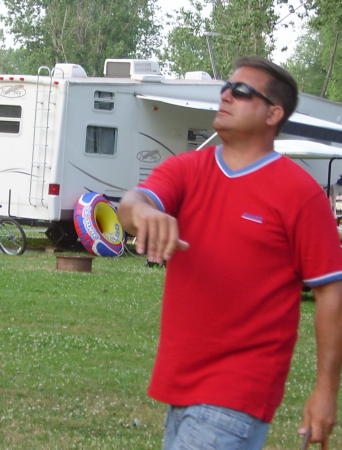 Michael playing horseshoes - camping