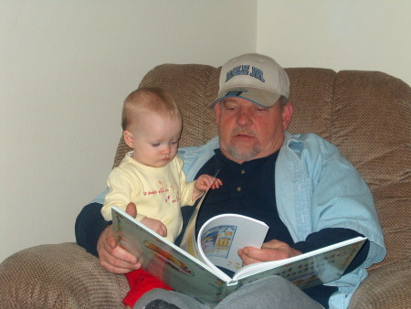 Papa David reading a book to brooke