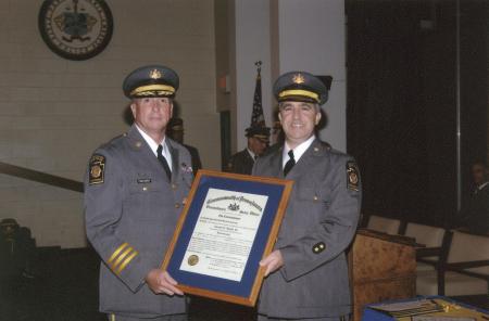 Receiving promotion from Commissioner