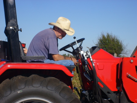 My husband Lloyd on his tractor
