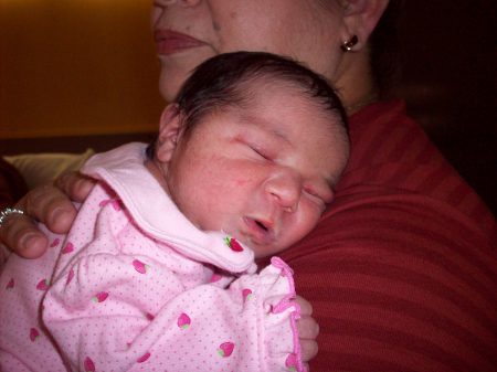 My granddaughter sleeping on grandma's shoulde