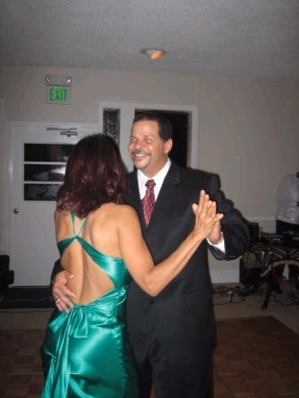 The big guy cutting up the rug with my mommy!! My stepfather!!