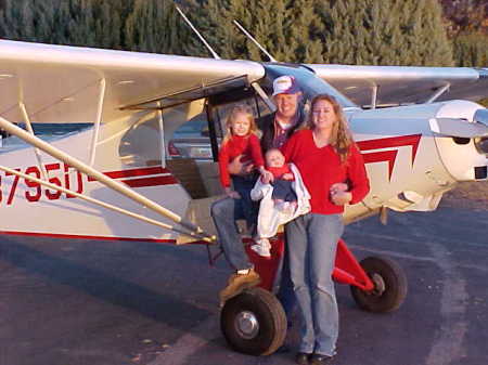 Fam. pic in front of our airplane