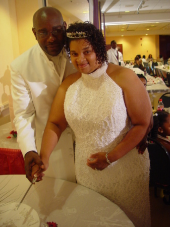 The Bride & Groom cutting the cake