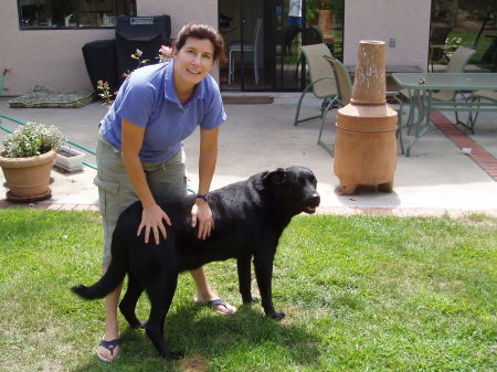 My wife Molly with our lab Syler in our backyard