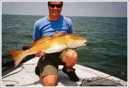 Tim with his redfish(yes I know it's yellow) out of the gulf of Mexico where we fish in Louisiana every year.