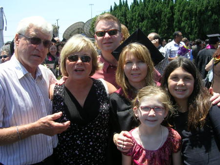 Me graduating w/my Masters in Education with my daughters Emily and Olivia, brother Wayne and mom and dad.