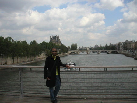 Standing on bridge over the Seine River in Paris