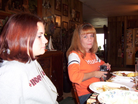 This is my baby girl whitney on the left and me in the Orange shirt