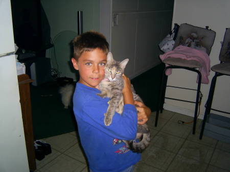 My kid, Ryan...7....( and his damn cat:)